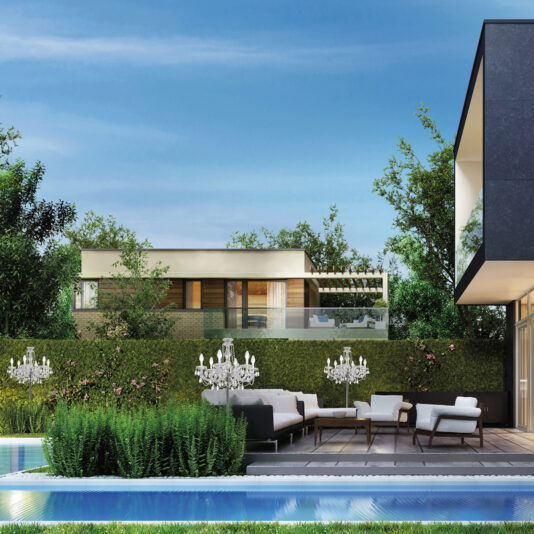 Outdoor Crystal Chandelier Table Lamp A stylish outdoor patio showcases elegant chairs and sofas around an Outdoor Crystal Chandelier Table Lamp on the coffee table, set on a wooden deck beside a pool. Lush greenery and a modern building adorn the background under a clear blue sky.