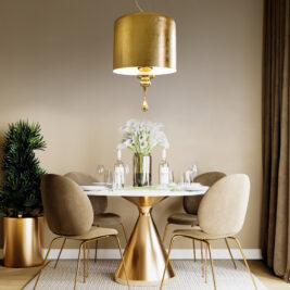 A sophisticated dining room features a round table with a gold base surrounded by four beige chairs, illuminated by a Modern Italian Designer Gold Leaf Ceiling Light. A vase of white flowers decorates the table while a potted plant adorns the corner.
