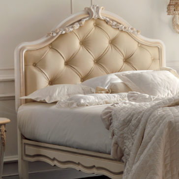 Italian Rose Detail Luxury Single Bed The Italian Rose Detail Luxury Single Bed features an elegant design with a plush, cream-colored, tufted headboard. It is neatly made with white and beige bedding, including a quilted comforter and several pillows. The ornate carvings on the frame showcase exquisite Italian rose details, creating a cozy and luxurious setting.