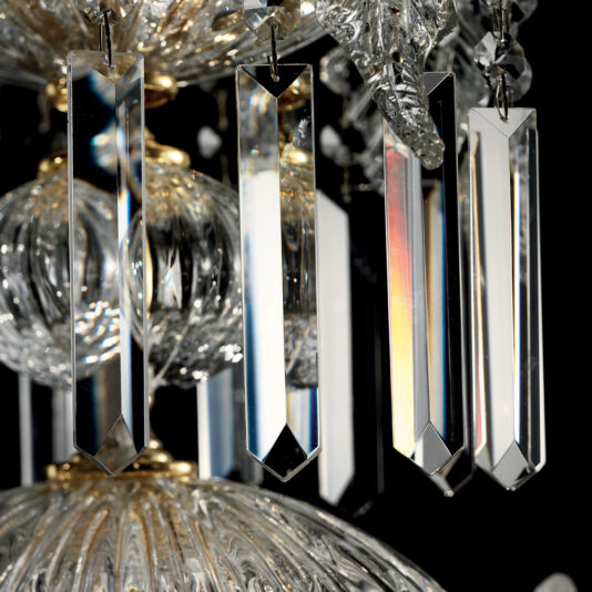 Close-up of the Ornate Italian Drop Crystal Pendant Chandelier showcasing its magnificent hanging crystal prisms reflecting light. The image highlights the intricate details of the crystals and the golden accents that suspend them, all set against a black background that enhances the clarity and sparkle of the prisms.