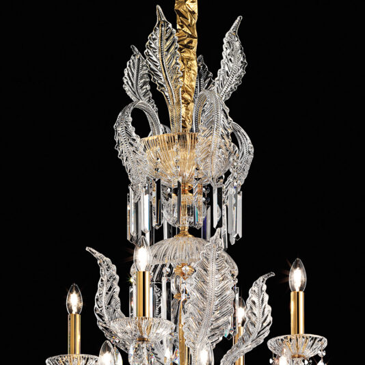 A close-up of the **Ornate Italian Drop Crystal Pendant Chandelier** reveals its intricate crystal and gold accents. This chandelier showcases decorative crystal leaves, gold elements, and multiple candle-like light bulbs, all contributing to its gleaming, elegant design set against a black background.