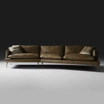 The Modern Leather Modular Sofa, finished in brown leather upholstery, comes with four plush cushions—two large seat cushions and two smaller throw pillows—perfectly set against a dark background. The sofa is designed with sleek, slim metal legs for a contemporary look.