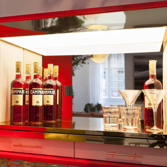 Contemporary Designer Cocktail Bar Cabinet inside a red cocktail cabinet with a mirror back