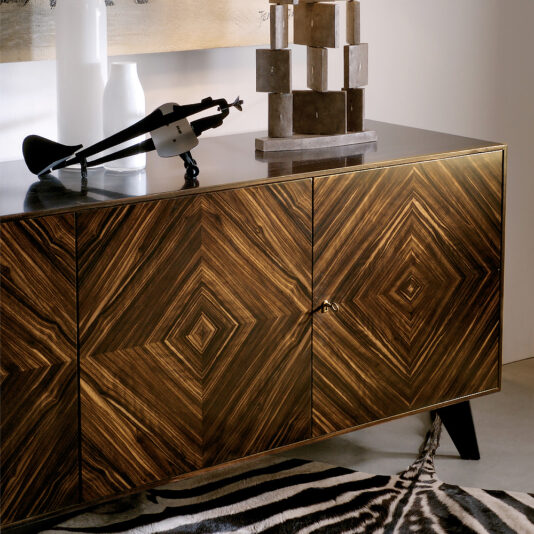 Luxury Italian Patterned Ebony Veneered Sideboard A Luxury Italian Patterned Ebony Veneered Sideboard with geometric designs is paired with a zebra-patterned rug. A small sculpture and decorative items adorn the top, while warm lighting highlights the elegant modern atmosphere.