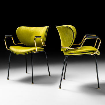 Two High End Designer Retro Style Carver Dining Chairs with bright yellow-green cushioned seats and backrests. These chairs feature sleek black metal legs and elegant golden armrests, all set against a gradient dark to light background.