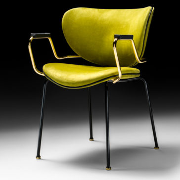 The High End Designer Retro Style Carver Dining Chair boasts a modern design with a luxurious, lime-green cushioned seat and backrest. It features elegant golden-framed armrests and stands on four slender black legs, enhanced by golden-tipped feet. The chair is set against a background that transitions from white to black.