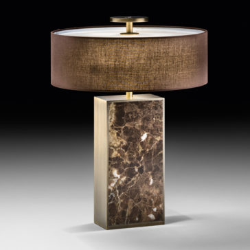 Modern Marble Designer Bronze Table Lamp The Modern Marble Designer Bronze Table Lamp showcases a modern aesthetic with a rectangular base highlighted by dark brown tones and white veining. This designer piece features a cylindrical brown fabric shade capped with a light diffuser, casting a warm glow. The elegant design is perfectly accentuated against a dark gradient background.