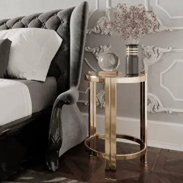 Art Deco Inspired Designer Contemporary Luxury Side Table A luxurious Art Deco-inspired bedroom with a gray upholstered bed, white and gray bedding, and an Art Deco Inspired Designer Contemporary Luxury Side Table. The table holds a glass orb and a cylindrical vase with dried flowers. The room features intricate wall paneling and a herringbone wooden floor.