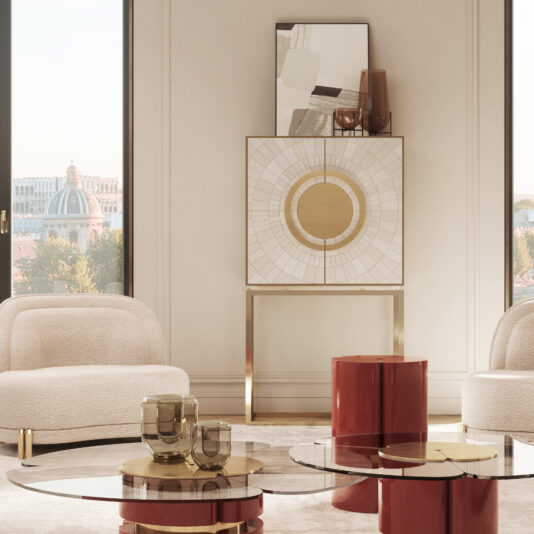 Exclusive Marble Art Deco Inspired Contemporary Cabinet A modern living room with a large window view of an urban landscape. Two white armchairs flank the Exclusive Marble Art Deco Inspired Contemporary Cabinet, which is topped with abstract art. In the foreground, circular glass coffee tables are adorned with red and gold decor items, enhancing the Art Deco-inspired elegance.