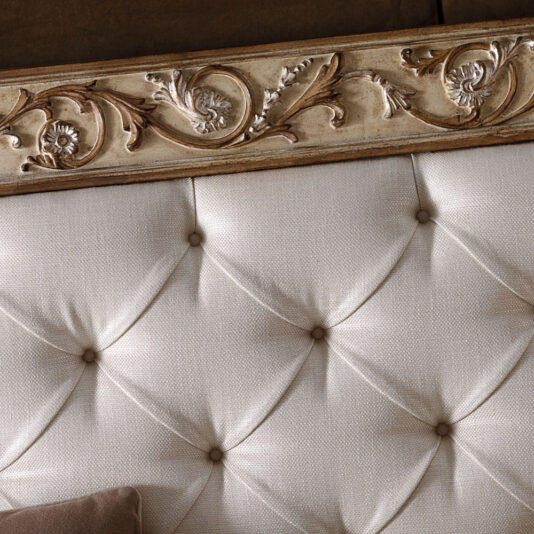 Antiqued Italian Button Upholstered Bed With Ornate Carvings Antiqued Italian Button Upholstered Bed With Ornate Carvings