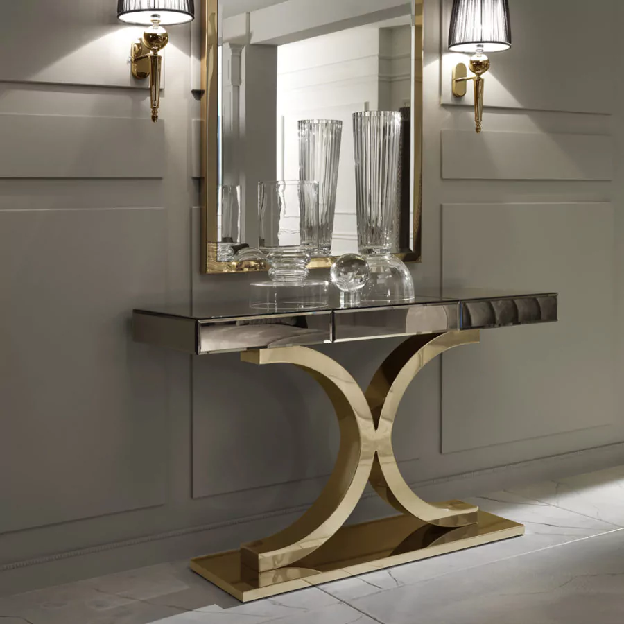 Console table with a bronze mirrored glass top and curved gold-finish frame