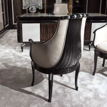 Exclusive Designer Italian High Gloss Lacquered Leather Chair The Exclusive Designer Italian High Gloss Lacquered Leather Chair in black and beige with curved wood accents sits on a light gray carpet, paired with an elegant desk and matching furniture in a modern office.