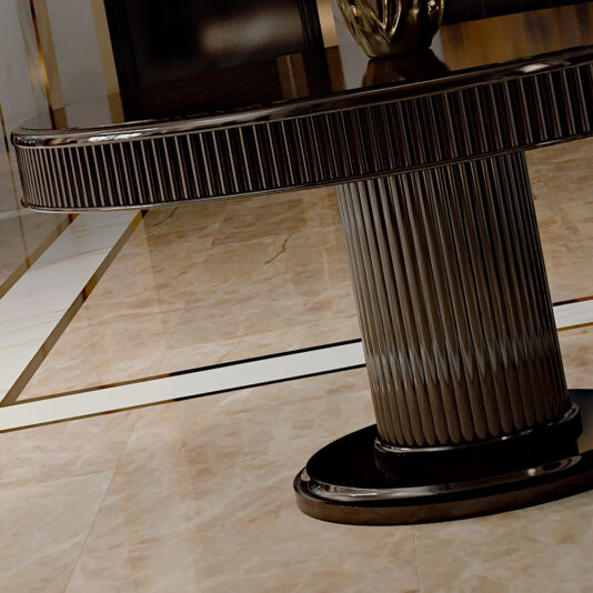 Italian Designer Lacquered Art Deco Inspired Dining Table A close-up view of the luxurious Italian Designer Lacquered Art Deco Inspired Dining Table features a textured, dark-colored cylindrical base. The opulent dining table stands on a polished marble floor with elegant gold-accented lines, reflecting its sumptuous surroundings.