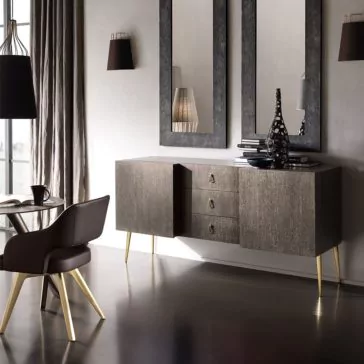 Italian Designer Leather Armchair A modern living room features a sleek sideboard with three drawers and two cabinets, adorned with decorative vases and books. Two large mirrors hang above it, reflecting a stylish hanging lamp and a round table with an Italian Designer Leather Armchair. Sunlight filters through beige curtains.