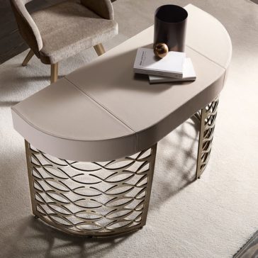 Luxury Italian Designer Bronze Frame Desk A Luxury Italian Designer Bronze Frame Desk with a smooth beige top and gold metal base is paired with a beige upholstered chair on light carpet. Books, a decorative sphere, and a vase enhance the sophisticated workspace.