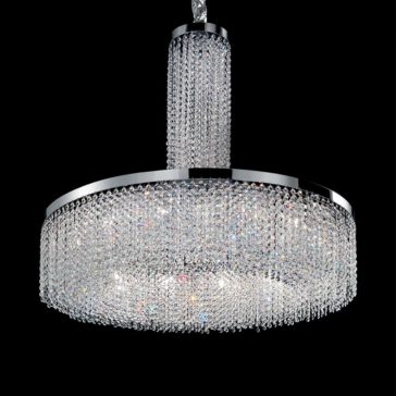 Cut Crystal Round Chandelier The Cut Crystal Round Chandelier exudes luxury with its two tiers of cascading, sparkling crystals that hang from a sleek silver frame. It features a stunning cylindrical column of crystals connecting it seamlessly to the ceiling mount, all set against a black background that highlights its brilliance and elegance.
