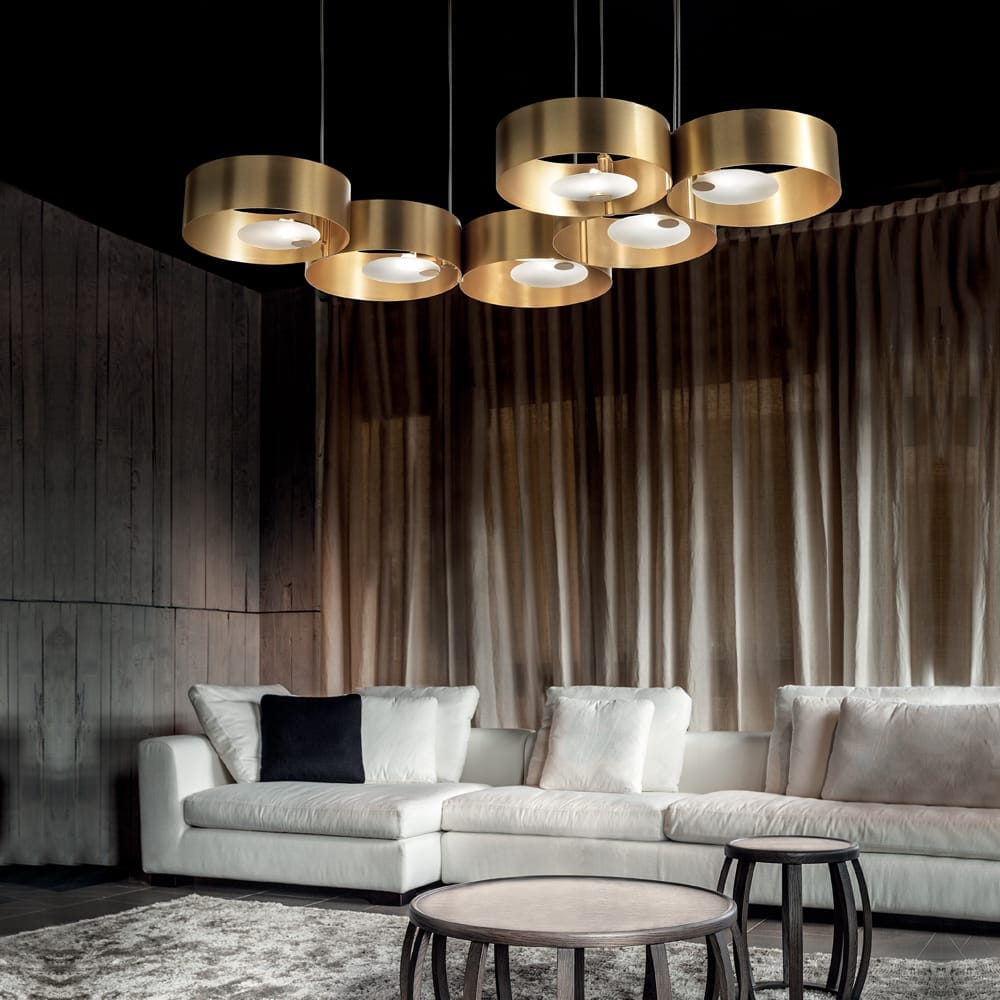 lighting trends 2020, large ceiling light with gold rings and exposed bulbs