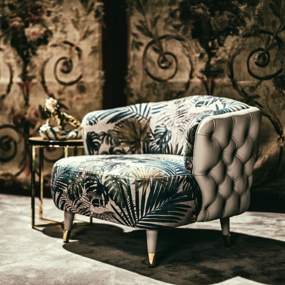 interior design trends 2020, leather button upholstered chair with bold, botanical fabric seat