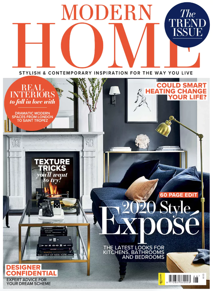 Modern Home magazine cover showcases a chic living room with a gray armchair, navy sofa, and wooden coffee table. Headlines: 