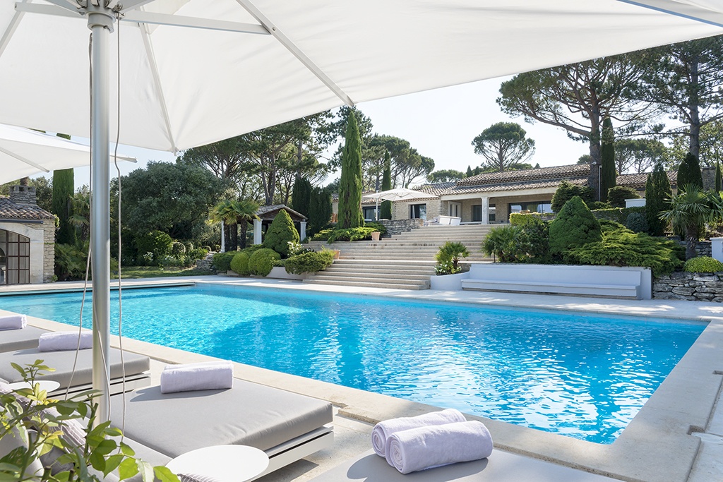 Winner European Property Awards 2018-2019 Best Interior Design Private Residence France - Luxury Family Home, exquisite villa in the south of France, with grand stairs leading down to a large pool.