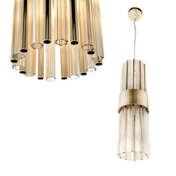 Modern Vertical Pendant Light Two Modern Vertical Pendant Lights with a chic cylindrical design feature elegant gold and glass chandeliers; the larger one hangs on the left, while a smaller version complements it on the right, showcasing a stylish blend of transparent and metallic elements.