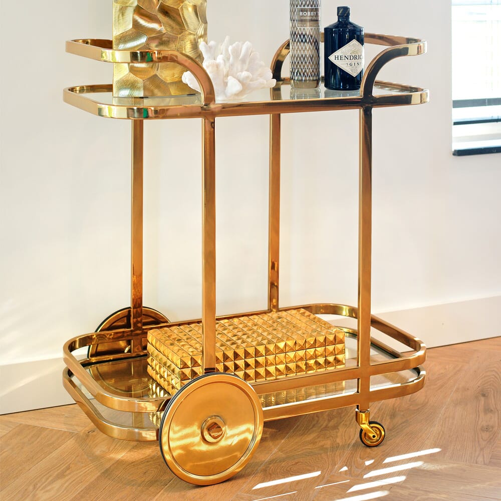 interior design trends, drinks trolley in gold finish, art deco inspired
