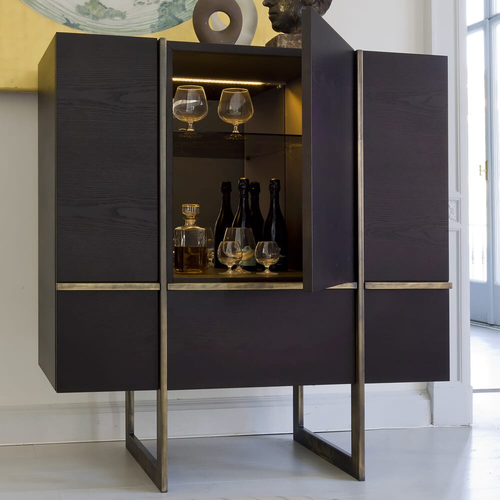 interior design trends, contemporary cocktail cabinet in dark wood with brushed brass accents