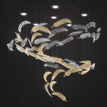 Exclusive Floating Feather Chandelier The Exclusive Floating Feather Chandelier suspends delicate gold and silver feather-inspired elements on thin wires from a dark ceiling, creating an airy, floating look enhanced by overhead spotlights.