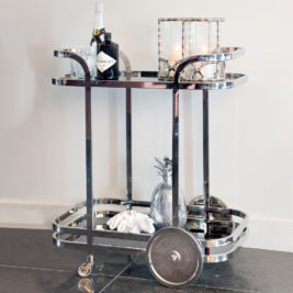 art deco style drinks trolley, polished steel with black glass shelves