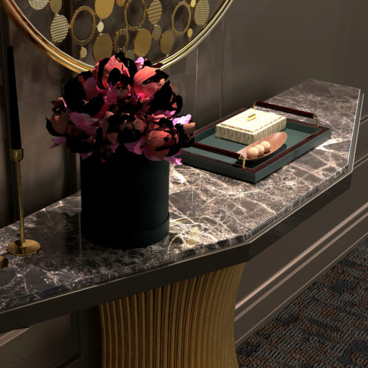 Marble Demi Console A Marble Demi Console displays a black vase with dark pink flowers, a tray with books, decorative beads, and a pen. Above it is a round mirror with a geometric gold frame, adding an elegant touch.