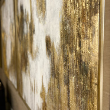 Original Gold Leaf Abstract Painting Close-up view of the Original Gold Leaf Abstract Painting, showcasing a white and gold color palette. The artwork features thick gold streaks and patches across a white canvas, with hints of various textures and layers creating a visually rich, metallic effect.