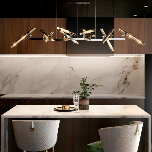 A modern kitchen features a marble backsplash and countertops, elegant wooden cabinets, and stylish green and beige upholstered chairs. The sleek aesthetic is further enhanced by the striking Contemporary Statement Chandelier with multiple arms and glass tubes hanging above the island, accentuating the clean, sophisticated design.