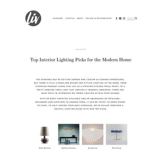 A web page from "liv" featuring an article titled "Top Interior Lighting Picks for the Modern Home." It includes images of four lighting products: Porta Romana, Juliette Interiors, Jondemoose, and Bert Frank. The article discusses trends in interior lighting.