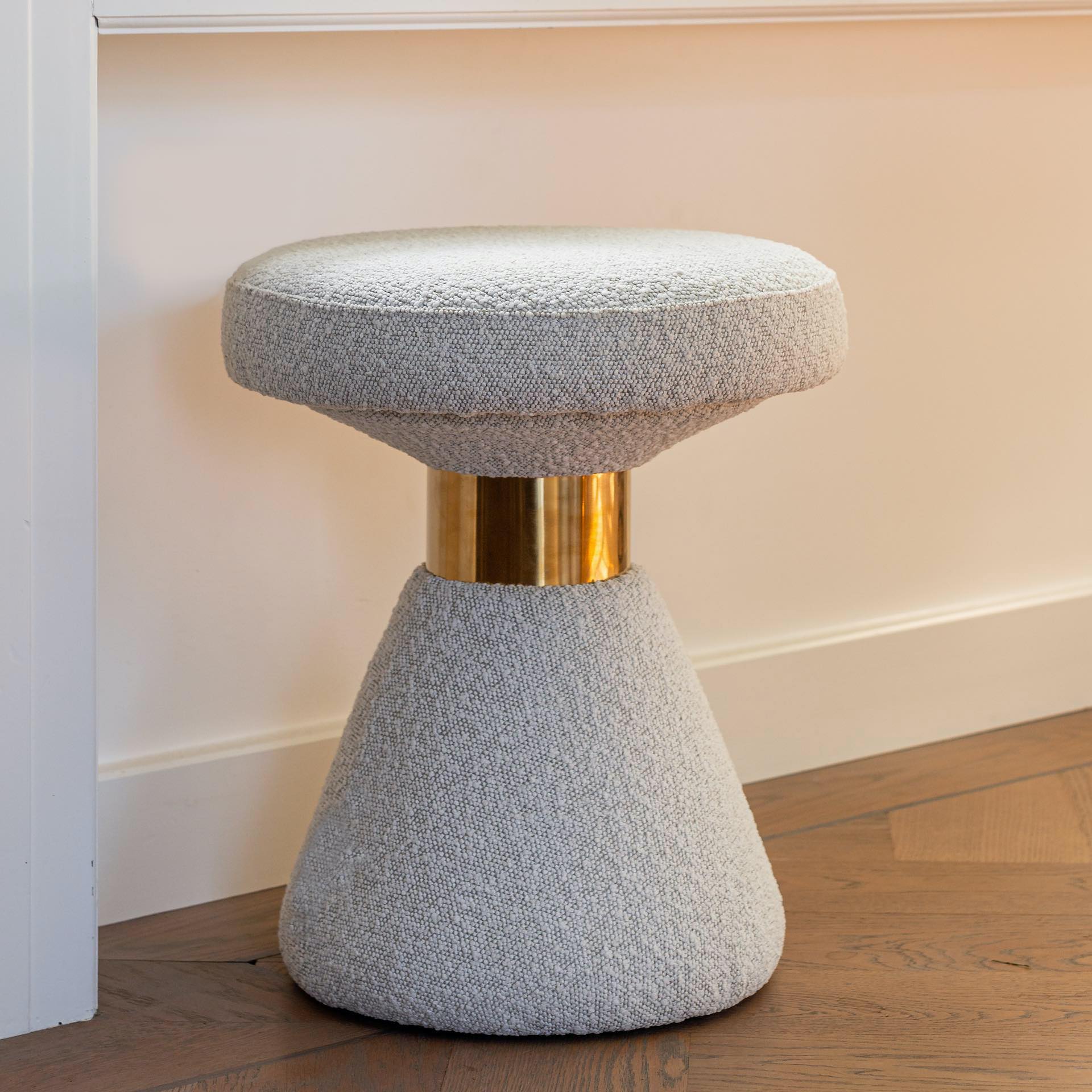 White Upholstered Pouffe With Gold Finish Detail