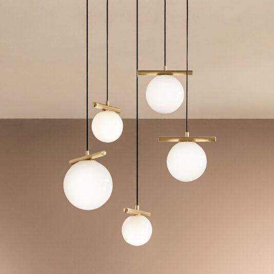 The Contemporary Murano Glass Pendant Light Chandelier boasts a minimalist design with contemporary Murano glass bulbs hanging at varied heights on black wires. Every round white bulb is complemented by a brass horizontal rod, all elegantly positioned against a beige and light brown background to create an exquisite pendant light display.