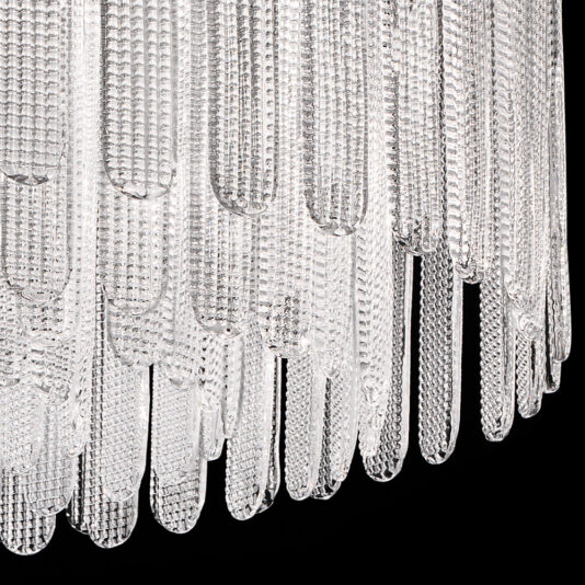 Contemporary Venetian Glass Chandelier Close-up image of the Contemporary Venetian Glass Chandelier, showcasing its elongated, textured glass pieces hanging in a layered fashion and reflecting light to create a sparkling effect against a dark black background.