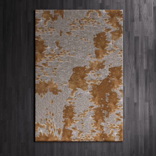 A High Quality Abstract Hand Woven Rug, featuring an abstract pattern in shades of brown and gray and laid on a dark wooden floor, showcases irregular patches that blend the two colors to create a textured appearance.