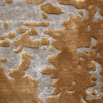 High Quality Abstract Hand Woven Rug The High Quality Abstract Hand Woven Rug is a premium area rug featuring a textured design with a random abstract pattern in brown and beige. The uneven and organic brown forms resemble splashes or patches on the beige base, creating a visually striking effect. Its surface appears soft and plush, adding a touch of luxury to any room.
