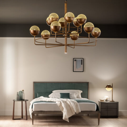 Large Modern Round Pendant Chandelier A modern bedroom showcases a bed with a green and white headboard, complemented by a cozy beige blanket. Beside it, there is a matching side table adorned with a lamp and decor items. From the ceiling hangs the Large Modern Round Pendant Chandelier, featuring numerous bulbs that illuminate the room brilliantly. The walls are decorated with minimalist artwork to complete the contemporary look.