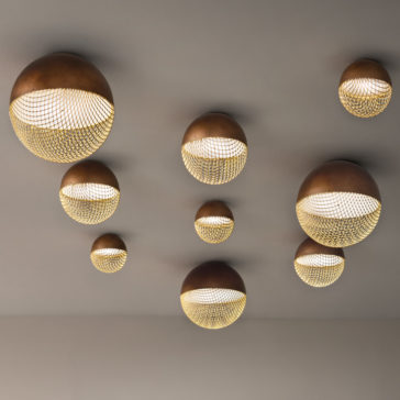 Modern Round Ceiling Light The ceiling is adorned with multiple Modern Round Ceiling Lights of varying sizes, each featuring a mesh-like pattern. These lights emit a warm, diffused glow, adding an artistic and modern touch to the room.