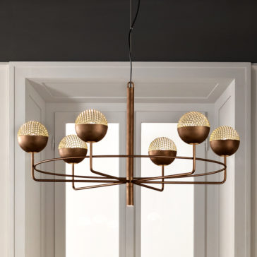 Modern Round Pendant Chandelier features a central rod with six horizontal arms extending outward, each supporting a textured spherical light. This elegant and minimalist chandelier is beautifully set against a white window frame background.