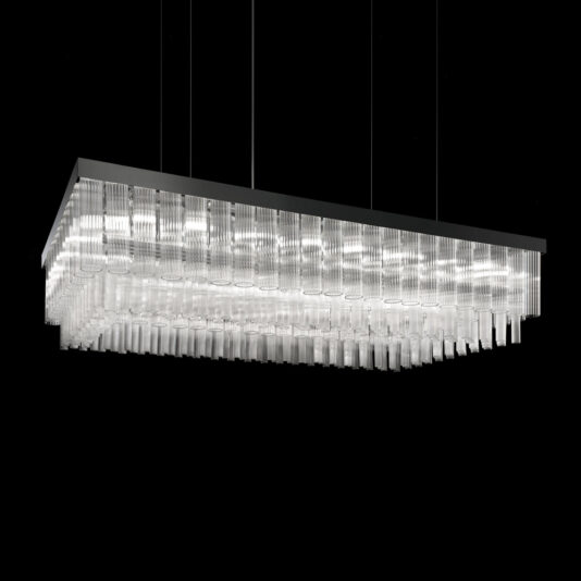 The Contemporary Venetian Glass Rectangular Chandelier features a black frame and numerous hanging Venetian glass tubes, illuminated against a black background. The glass tubes are arranged in a gradient, creating a cascading effect.