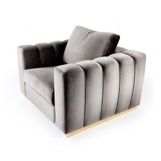 The Exclusive Modern Armchair boasts a chic, plush grey velvet finish with a tufted design highlighted by vertical stitching and a cushioned backrest. It features a soft, padded seat, sleek armrests, and a light wooden frame that offers an elegant contrast to the darker upholstery.