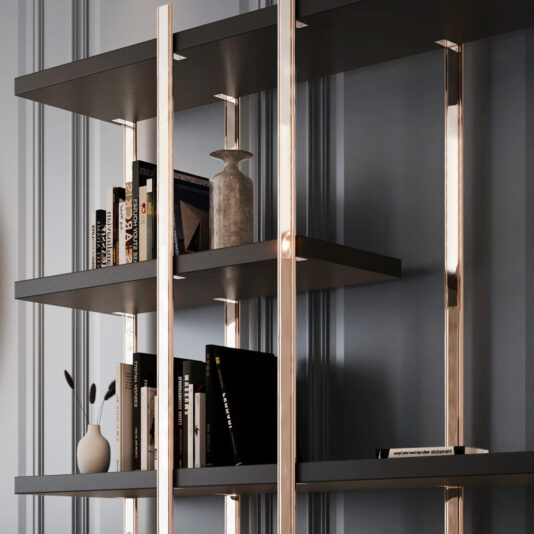 A Large Contemporary Open Bookcase with sleek, dark shelves and metallic supports holds an assortment of books, a small vase, a larger decorative jar, and a cylindrical object. The bookcase stands against a paneled, light grey wall.