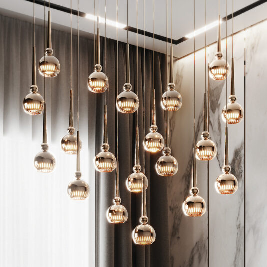 A cluster of modern hanging pendant lights with spherical glass bulbs arranged at varying heights creates an elegant and artistic display. Complemented by tall curtains and a marble accent wall, this luxurious interior boasts the Large Modern Crystal Pendant Style Chandelier as its centerpiece.