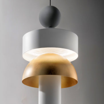 Modern LED Pendant Light The Modern LED Pendant Light showcases a contemporary minimalist design. It includes a large white cylindrical shade at the top and a gold hemispherical shade beneath it, both elegantly suspended by a black cord. This lighting fixture creates a warm and sophisticated ambiance.