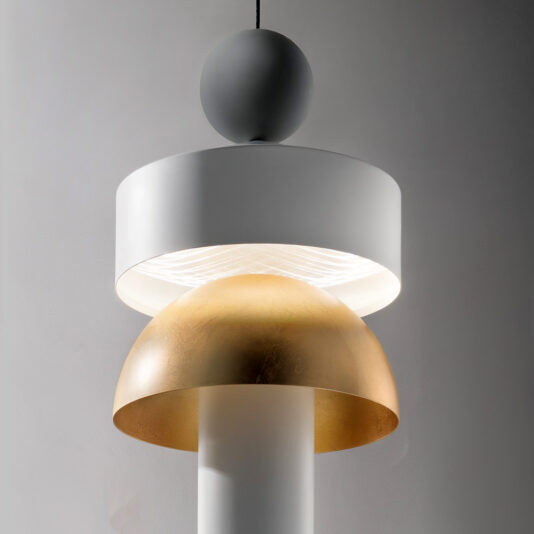The Modern LED Pendant Light showcases a contemporary minimalist design. It includes a large white cylindrical shade at the top and a gold hemispherical shade beneath it, both elegantly suspended by a black cord. This lighting fixture creates a warm and sophisticated ambiance.