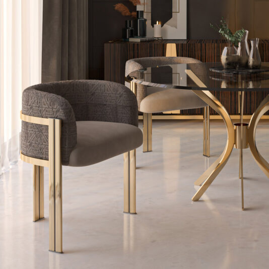 Elegant dining room showcasing the Modern Round Glass Dining Set, which includes a round glass-topped table with a gold base and two contemporary chairs featuring gold metal legs and textured, upholstered backs. The table is situated on a polished stone floor, accompanied by partially obscured cabinetry adorned with decorative items.