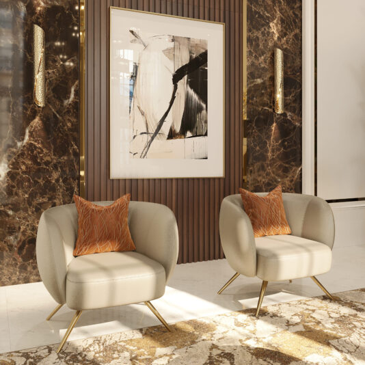 A modern interior features two Modern Leather Tub Armchairs in beige with orange accent pillows, positioned on a marble floor with a patterned rug. Behind them, a large abstract painting in black, white, and beige hangs on a dark marble wall, flanked by two wall lights.