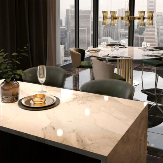 A modern dining area featuring the elegant Round Marble Dining Table And Chairs Set in the foreground, adorned with a glass of wine, a candle, and a coaster. The background showcases a stunning chandelier and large windows offering a breathtaking cityscape view with tall buildings.